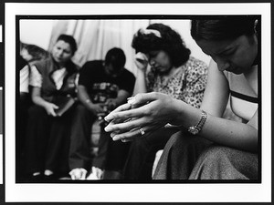 Prayer group sponsored by the Church of God, with people of South American origin, in a private home, Richmond, California, 2002