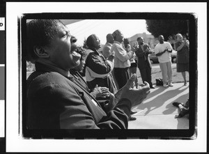 Men and women singing in prayer, Los Angeles, 1999