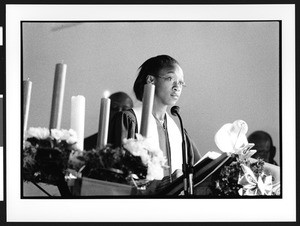 Young African American woman, standing behind pulpit, Zion Lutheran Church, Takoma Park, Maryland