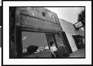 Man in wheel chair outside "Jobs For a Future", Dolores, Los Angeles, 1996