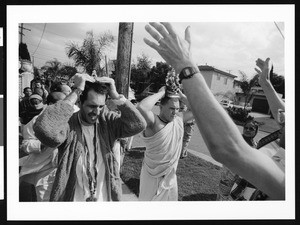 Men carrying religious articles on their heads in procession, Los Angeles, 1999