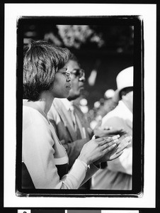 African American woman clapping, Los Angeles, 1999