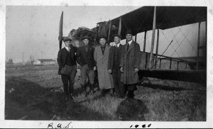 Charles Lee, Young K. Lee and three others in front of plane