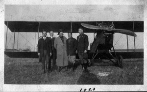 Young Lee, Byun Hoon Chang, Charles Lee and two others in front of plane