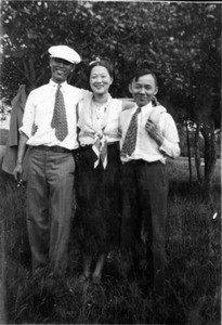 Mary Sohn and two men in park