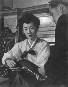 Florence Ahn and man reading "Korea Must Be Free"