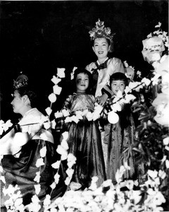 Florence Ahn in costume, on float