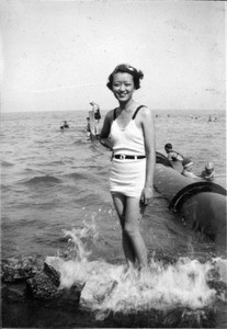 Helen Hur in bathing suit, at beach