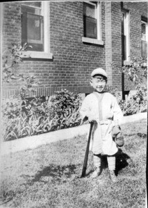 Richard Hahn in baseball uniform, leaning on bat