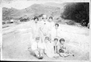 Photo of 8 in a field: young Korean-American ladies and men, about 1925