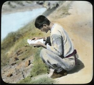 Man reading letter, Korea