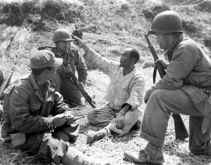 Marines talking with an elderly Korean