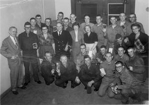 Twenty-eight Marines and others celebrating a book