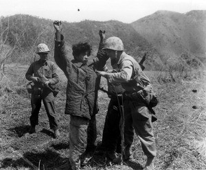 Marines search surrendered Chinese soldier