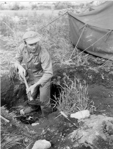 Martin Bolhower digging a hole