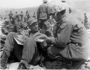 Captain Walter Lange confers with Lieutenant George Caridakis