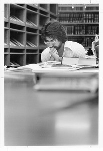 Student studying in the Periodicals Reading Room in Doheny Memorial Library, ca.1970s