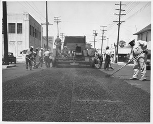 Rubber road installation along Figueroa St., Los Angeles, 1952