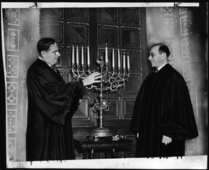 Rabbi Edgar F. Magnin and a Chanukiah, 1942