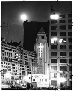 Los Angeles City Hall windows are lighted to form a giant cross, 1961