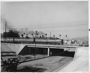 Los Feliz Blvd. bridge allows trains to pass without interrupting auto traffic, Los Angeles, 1957