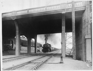 A train about to pass under the Seventh Street bridge