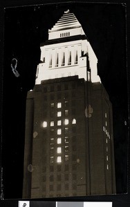 Night view of Los Angeles City Hall with traditional Yule cross formed by lights, ca. 1940