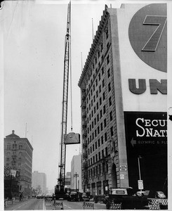 Crane lifting at the Petroleum Building, 1958