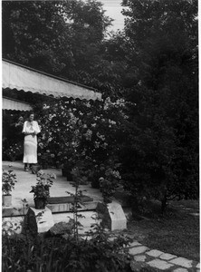 Alla Mae Moody in front of the Moody house in Shanghai