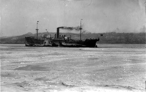 Ship in Vladivostok harbor, surrounded by ice