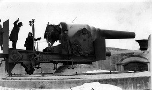 Mark Moody beside cannon at Vladivostok harbor fort