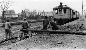 Downed power pole beside train tracks in Shanghai