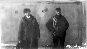 Mark Moody and another man in front of execution wall across from Vladvostok railroad station