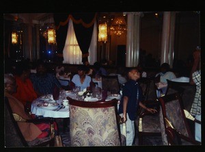 People gathered around banquet tables at an unidentified COGIC function