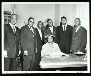 6 unidentified COGIC people in an office, Chicago, 1961