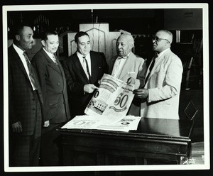 Ford & 4 unidentified men with 50th anniversary convocation posters, Memphis, 1957