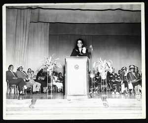 Unidentified woman at a podium