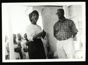 Caroline Claiborne and Rev. Warren Booker at tape cutting ceremony for Rep. Clark