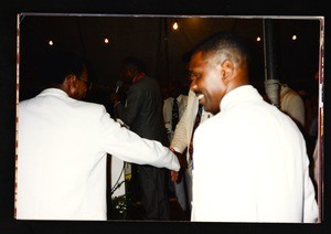 2 unidentified men in a crowd