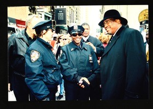 Unidentified man shaking hands with police, New York