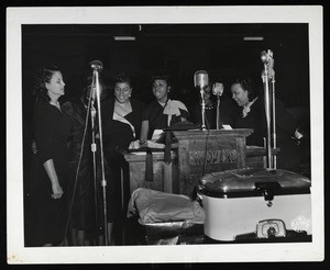 6 unidentified women singing at the pulpit, COGIC