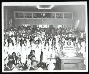 Group of people & a band at an unidentified COGIC service