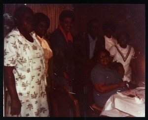 Photographs of people at a social gathering including Simmons & Clemmons