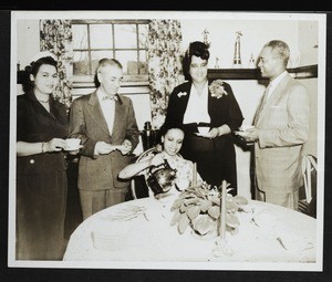 Arenia Mallory and 4 unidentified people in a dining room, Saints College?, Mississippi