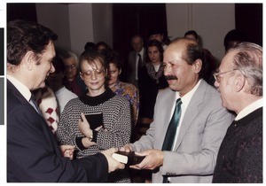 Baptized man receiving a Bible