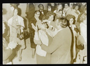 Unidentified man healing a woman, early 1960's