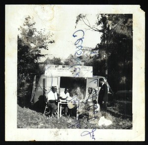 4 unidentified men at a mobile outreach unit