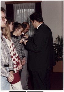 Baptized woman participating in Lord's Supper