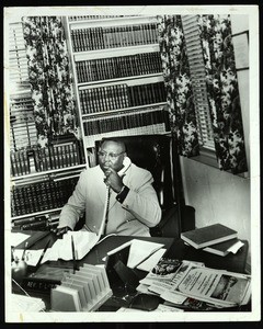 T.L. Young on phone, Dallas