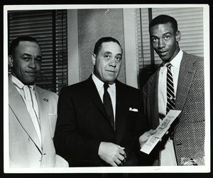 Louis Henry Ford & 2 unidentified men with 50th anniversary convocation leaflets, Chicago, 1957